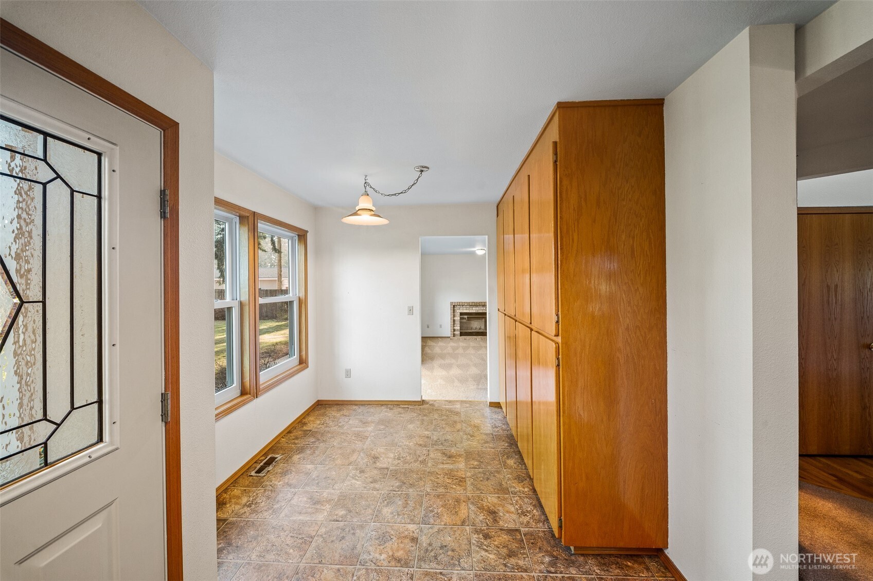 16011 Spanaway Loop Road South Spanaway, WA 98387 - Photo 10 of 35 a view of hallway with wooden floor and cabinet