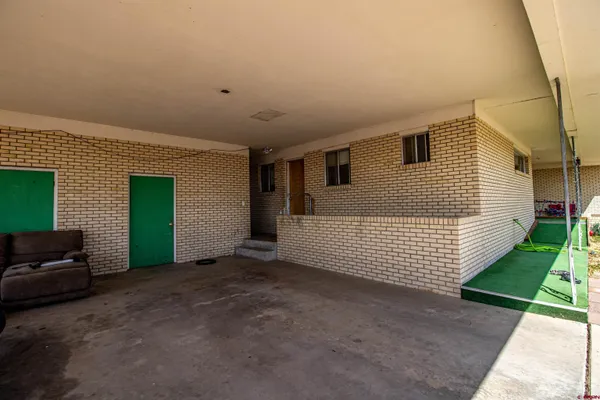 a view of a house with a yard and garage