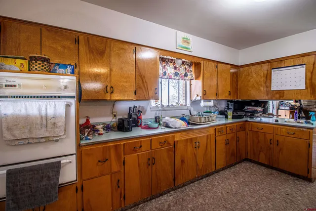 a view of empty room with a white door
