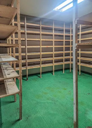 a view of a wooden deck and a yard