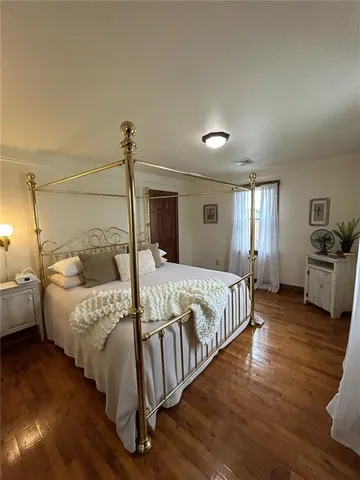 a bed room with a bed and a night stand