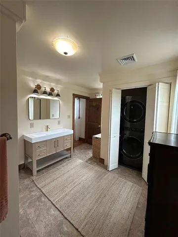 a view of wooden floor and a window in a room