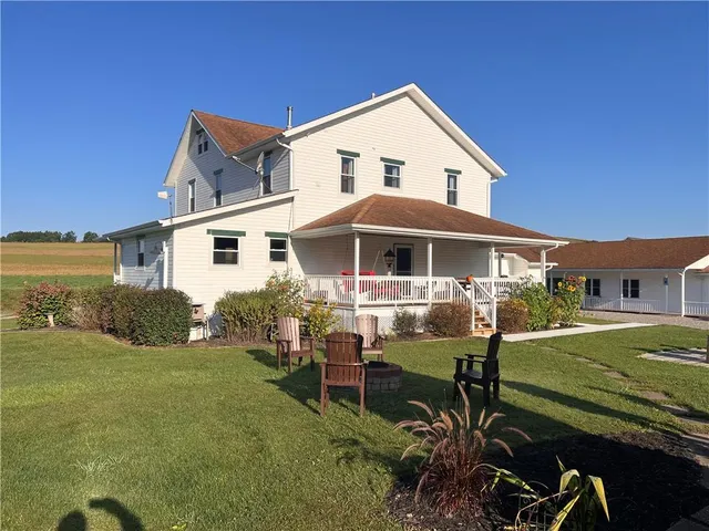 a living room with furniture rug and window