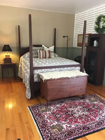 a large bedroom with a large bed and furniture