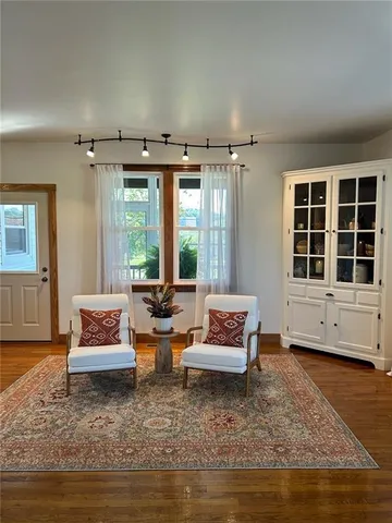 a living room with furniture and a rug