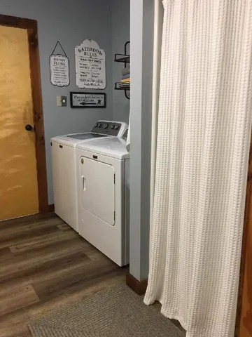 a kitchen with stainless steel appliances granite countertop a sink and a refrigerator