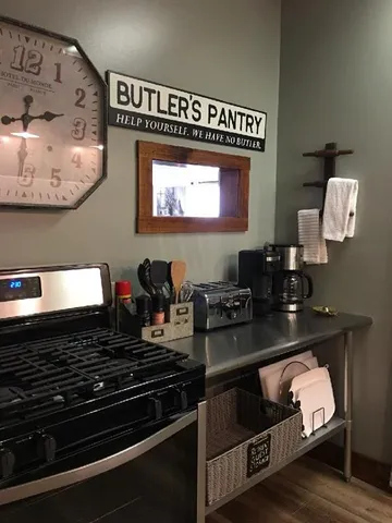 a white refrigerator freezer and a cabinet in a kitchen