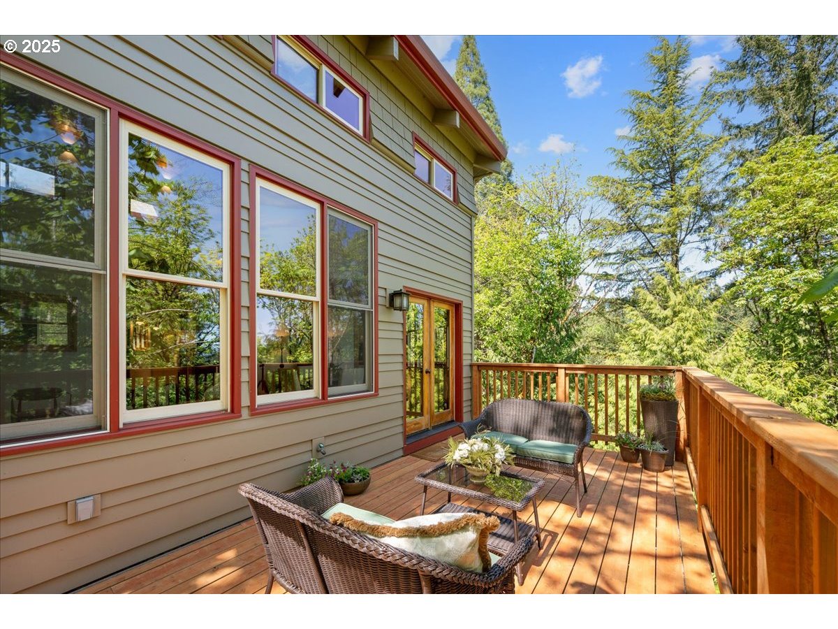 4908 Southwest Barnes Road Portland, OR 97221 - Photo 19 of 40 a view of a patio with a table and chairs