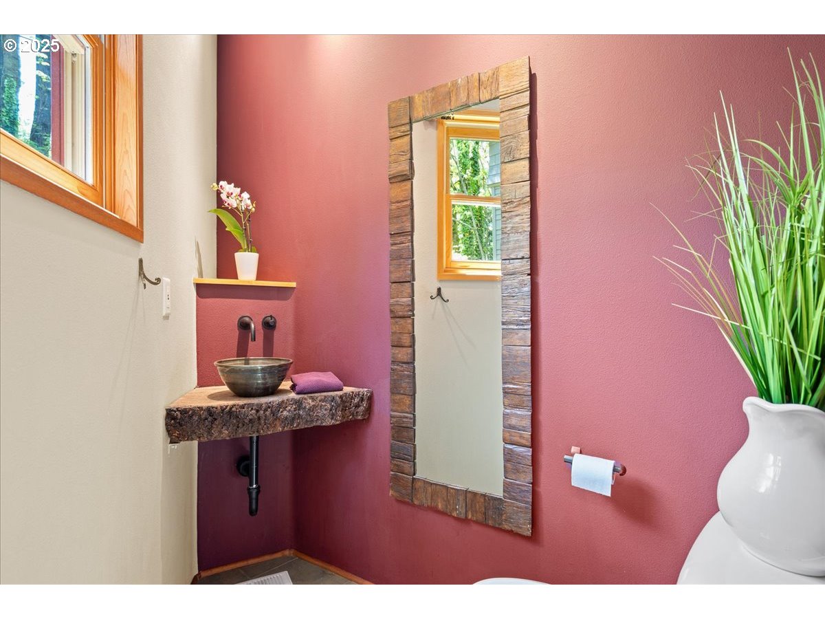 4908 Southwest Barnes Road Portland, OR 97221 - Photo 20 of 40 a kitchen with a sink and a mirror