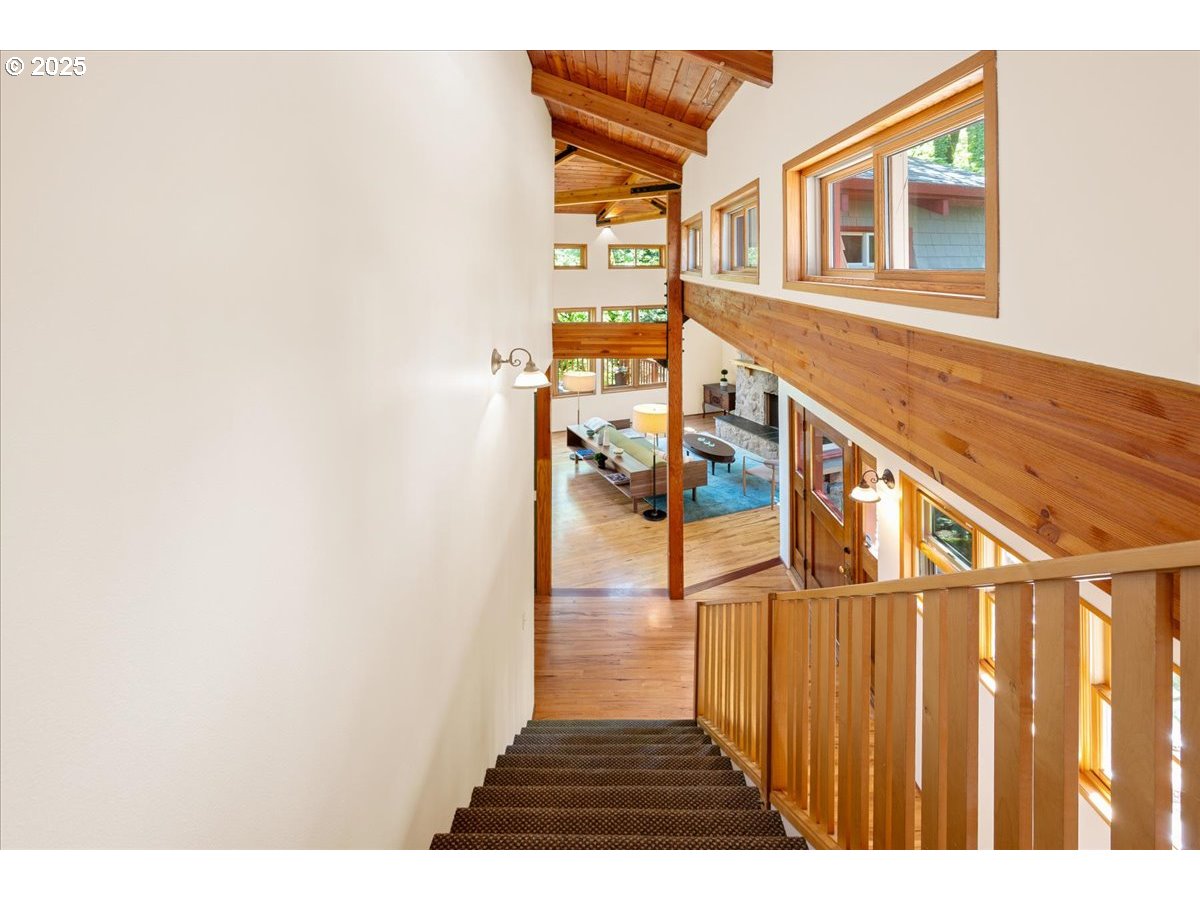 4908 Southwest Barnes Road Portland, OR 97221 - Photo 21 of 40 a view of a house with wooden floor and a window
