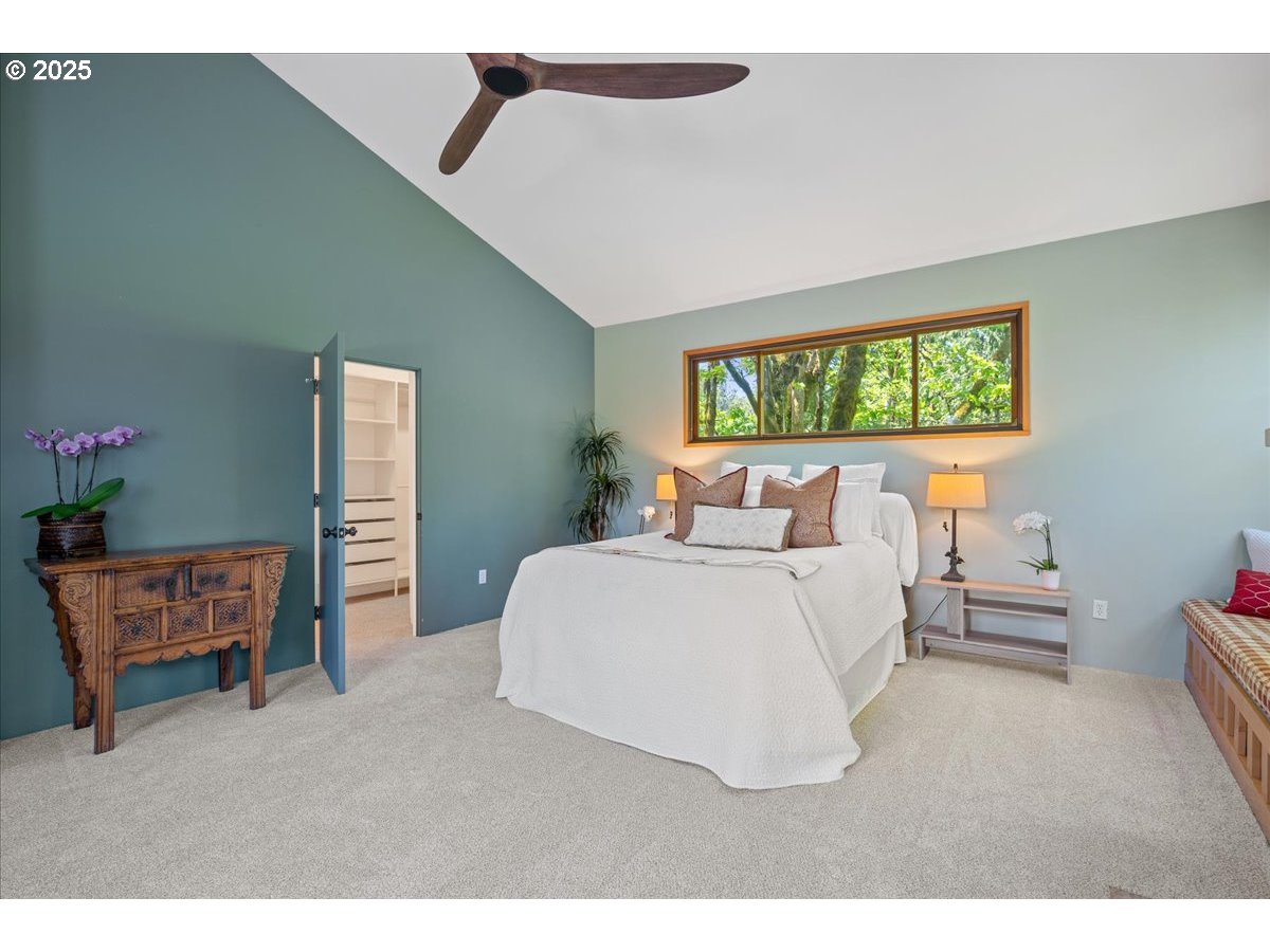 4908 Southwest Barnes Road Portland, OR 97221 - Photo 24 of 40 a bedroom with bed and window