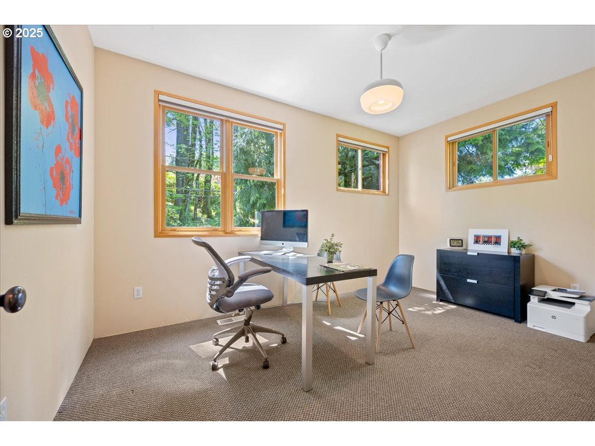 4908 Southwest Barnes Road Portland, OR 97221 - Photo 27 of 40 a workspace with furniture and a window