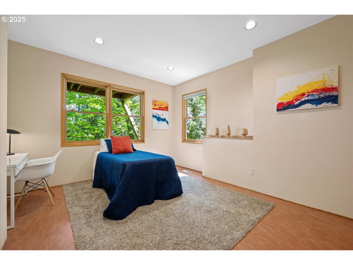 4908 Southwest Barnes Road Portland, OR 97221 - Photo 35 of 40 a living room with furniture and a large window
