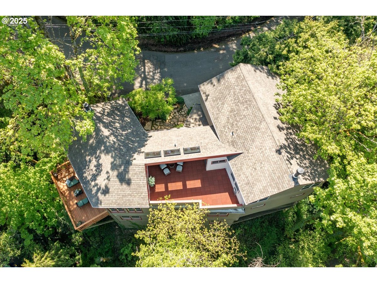 4908 Southwest Barnes Road Portland, OR 97221 - Photo 39 of 40 an aerial view of a house with a yard and lake view
