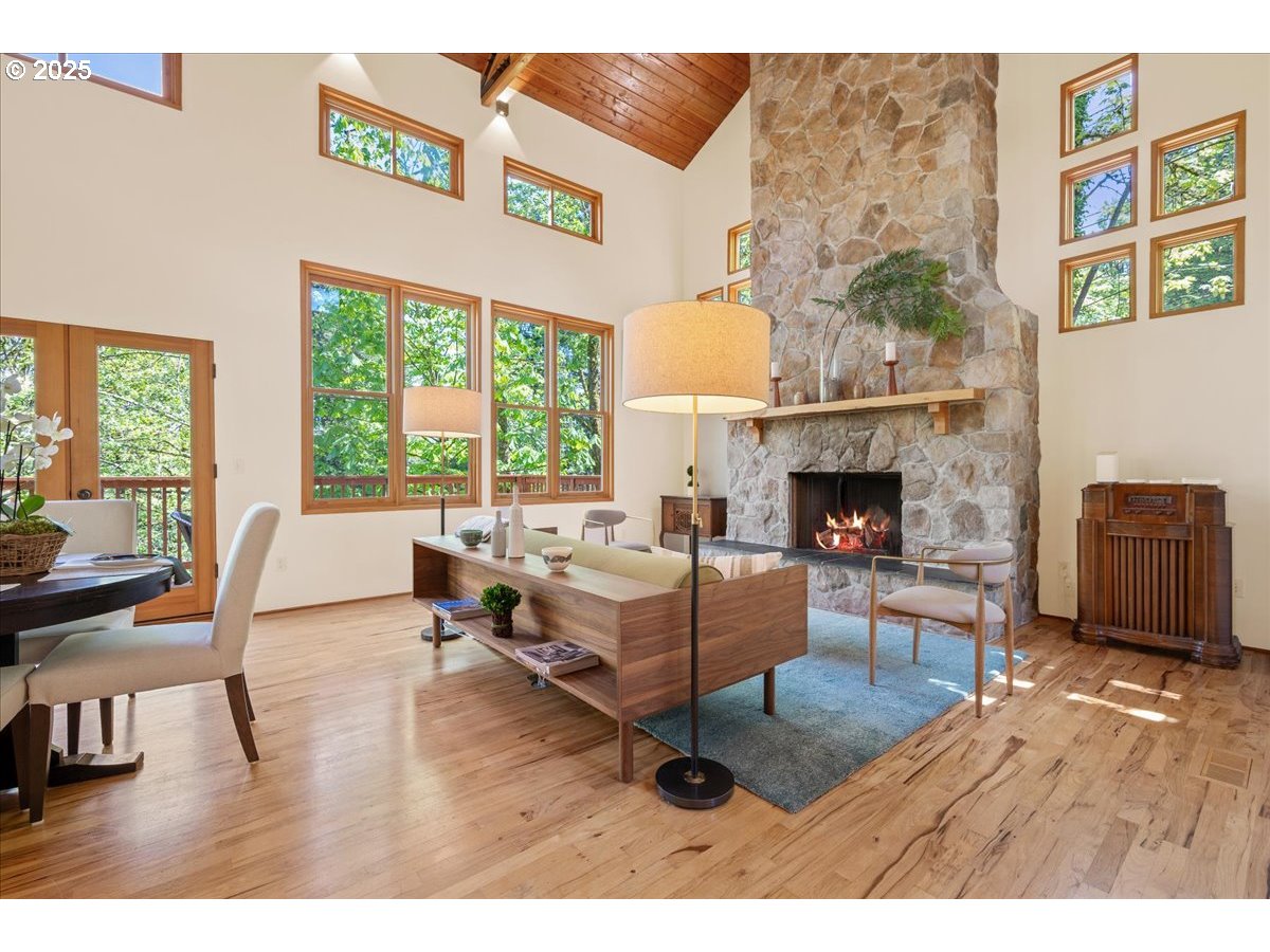 4908 Southwest Barnes Road Portland, OR 97221 - Photo 5 of 40 a living room with furniture and a fireplace