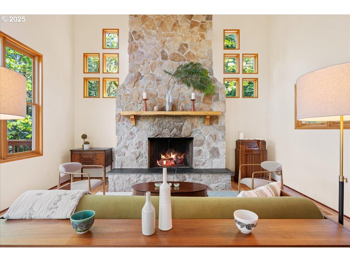 4908 Southwest Barnes Road Portland, OR 97221 - Photo 6 of 40 a living room with furniture and a fireplace