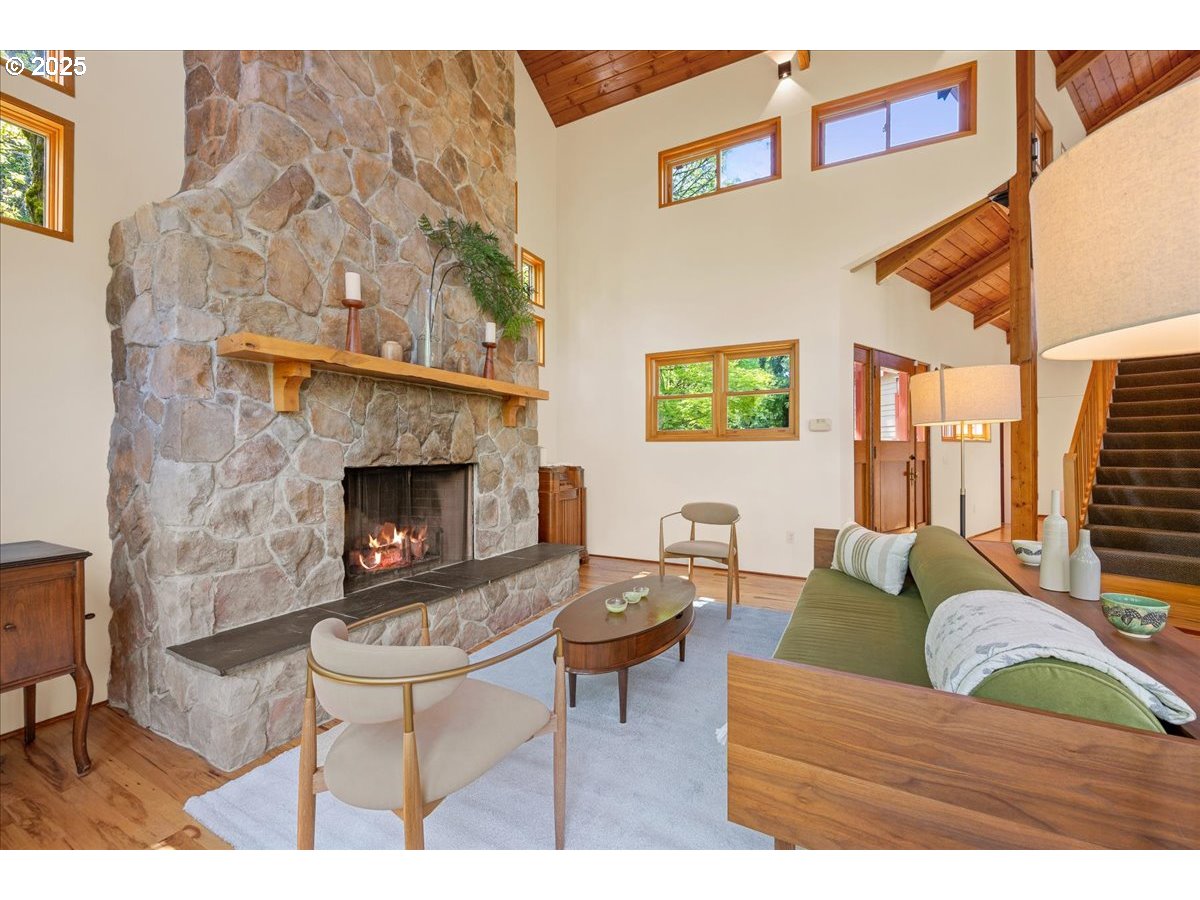 4908 Southwest Barnes Road Portland, OR 97221 - Photo 7 of 40 a living room with furniture and a fireplace