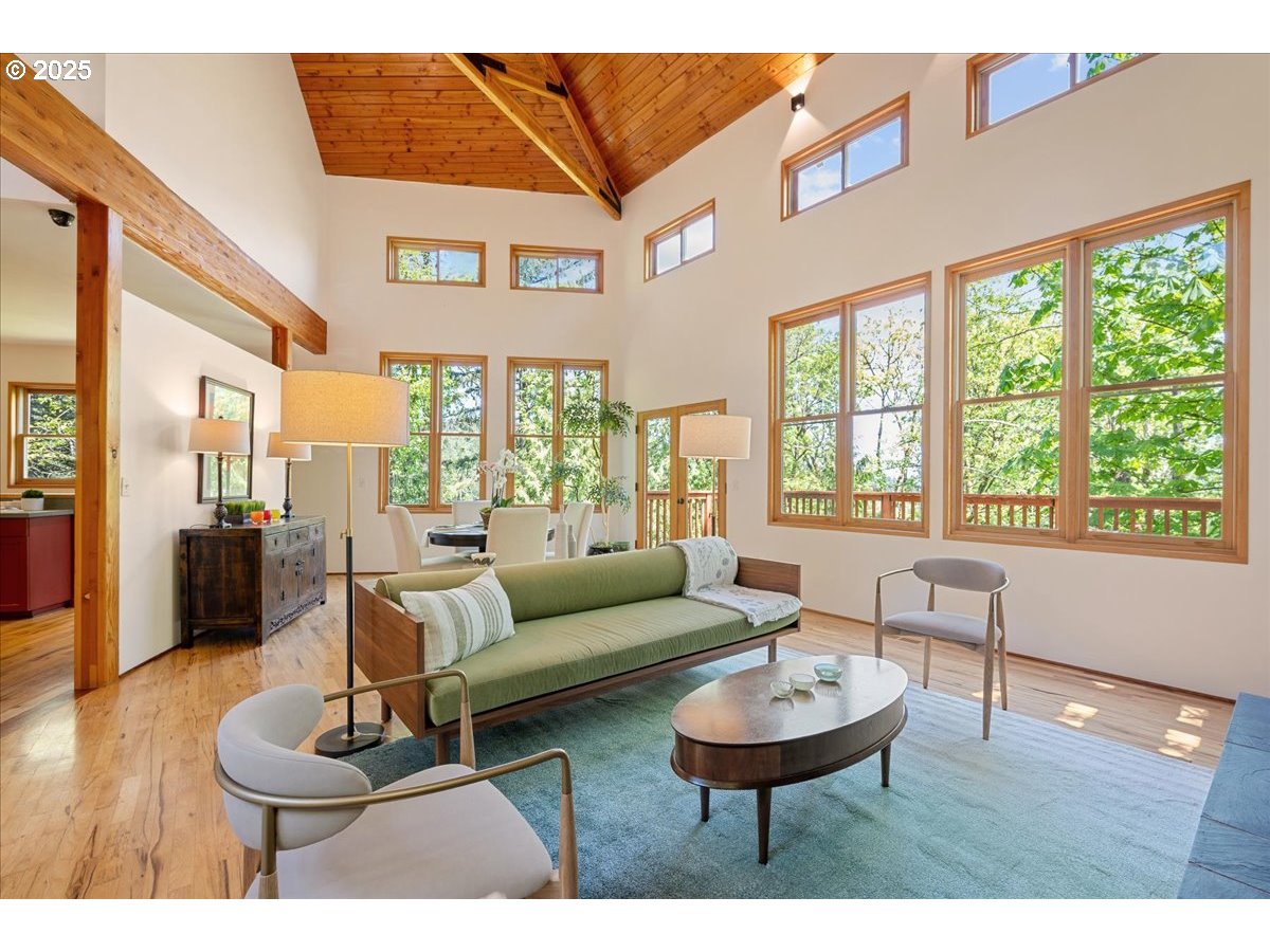 4908 Southwest Barnes Road Portland, OR 97221 - Photo 8 of 40 a living room with furniture and a large window