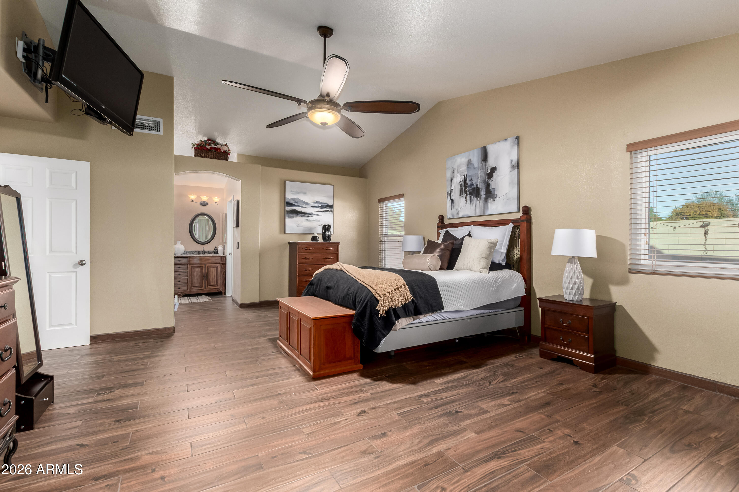 1147 North Marvin Street Gilbert, AZ 85233 - Photo 13 of 31 a bedroom with furniture and a wooden floor