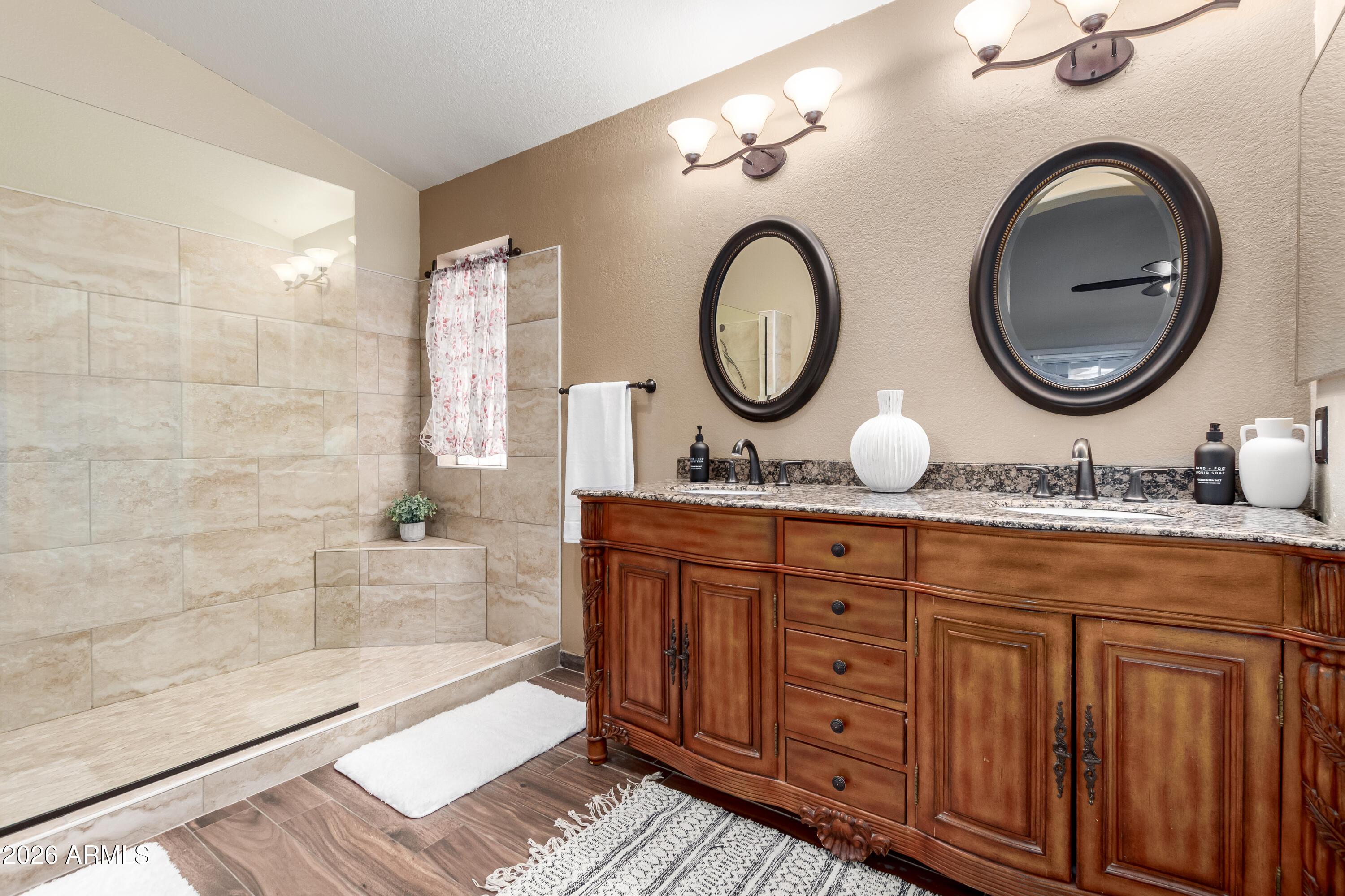 1147 North Marvin Street Gilbert, AZ 85233 - Photo 16 of 31 a bathroom with a granite countertop double vanity sink and a mirror