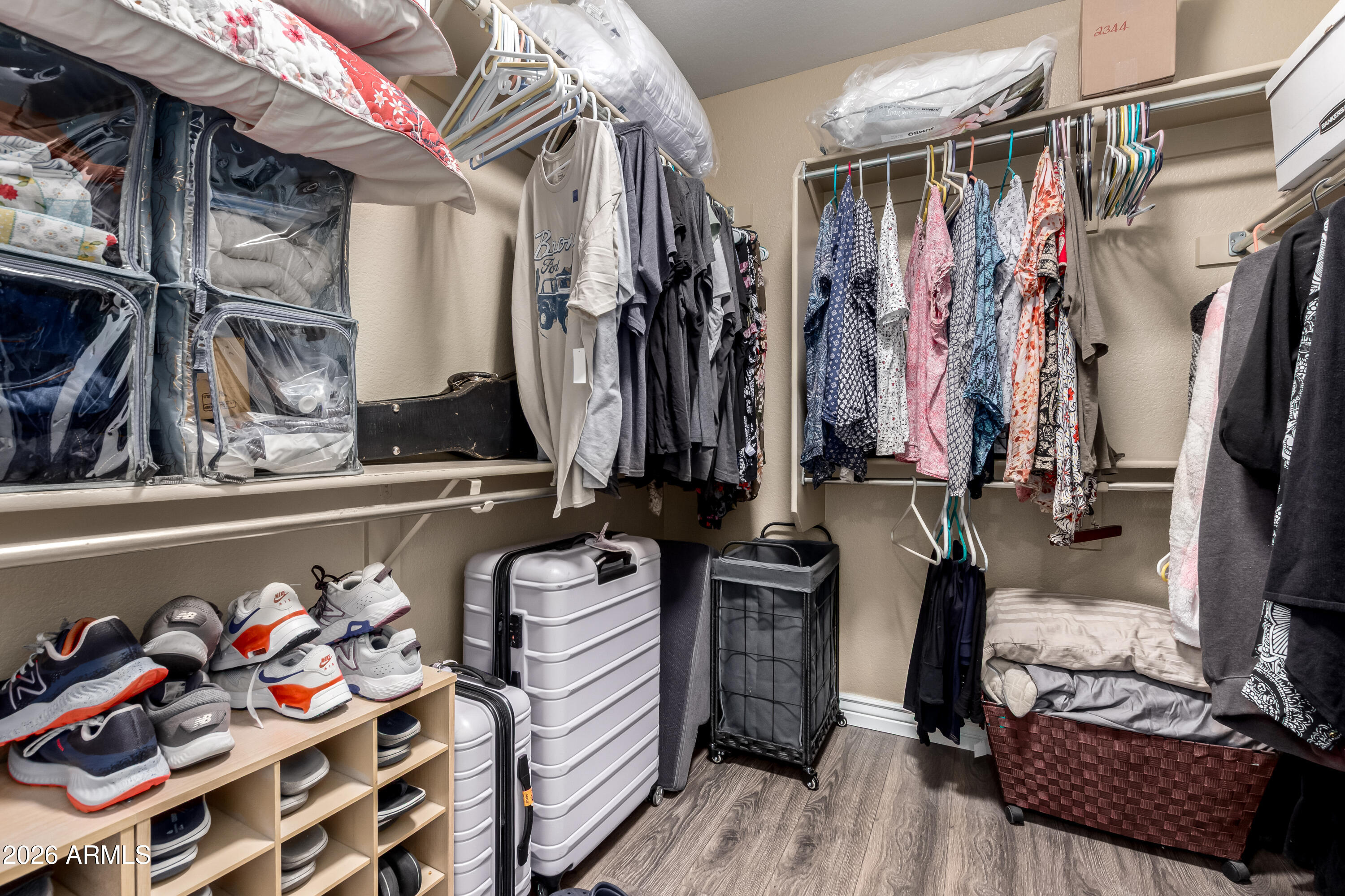 1147 North Marvin Street Gilbert, AZ 85233 - Photo 17 of 31 a view of walk in closet with clothes