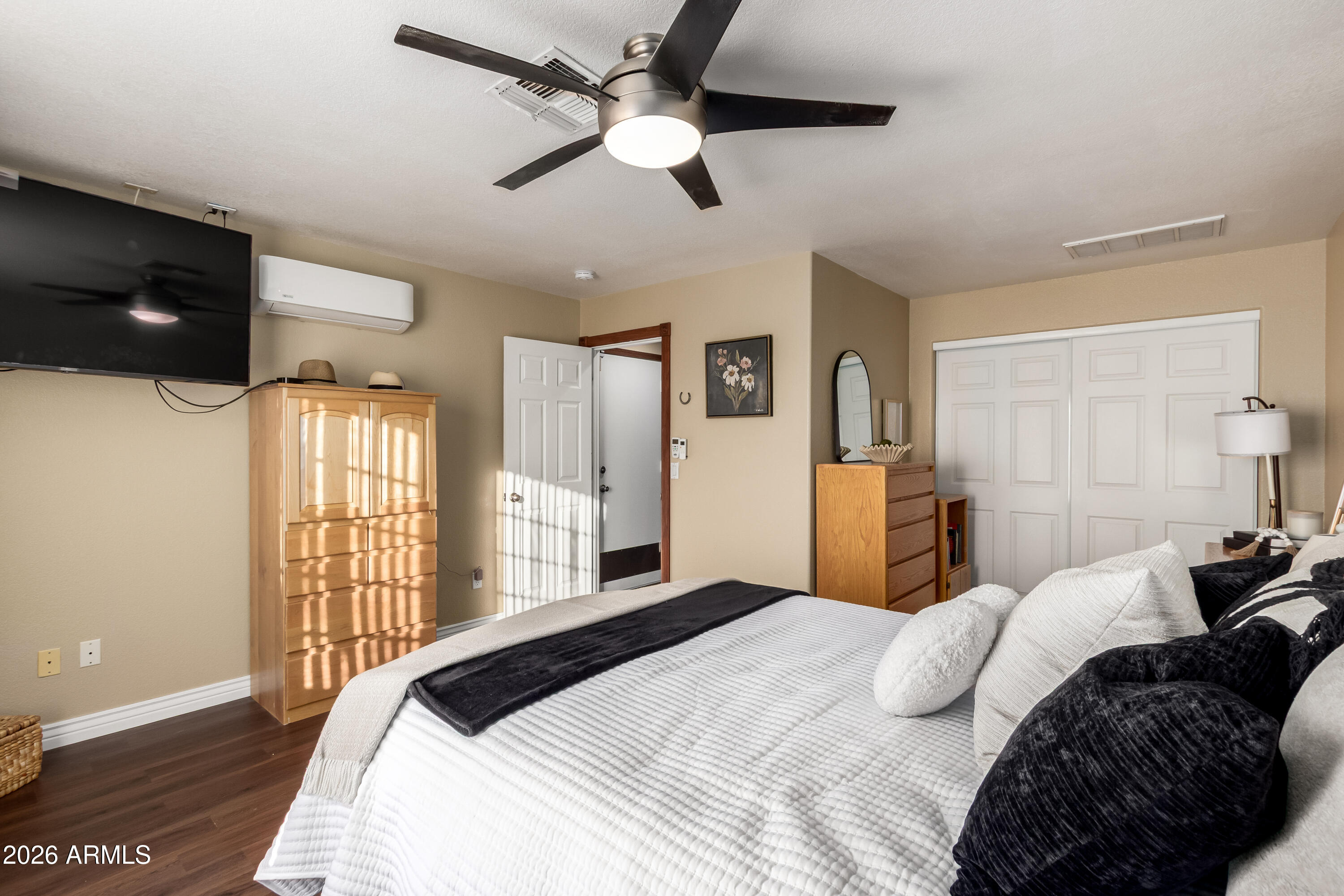 1147 North Marvin Street Gilbert, AZ 85233 - Photo 19 of 31 a bedroom with a bed tv and a window