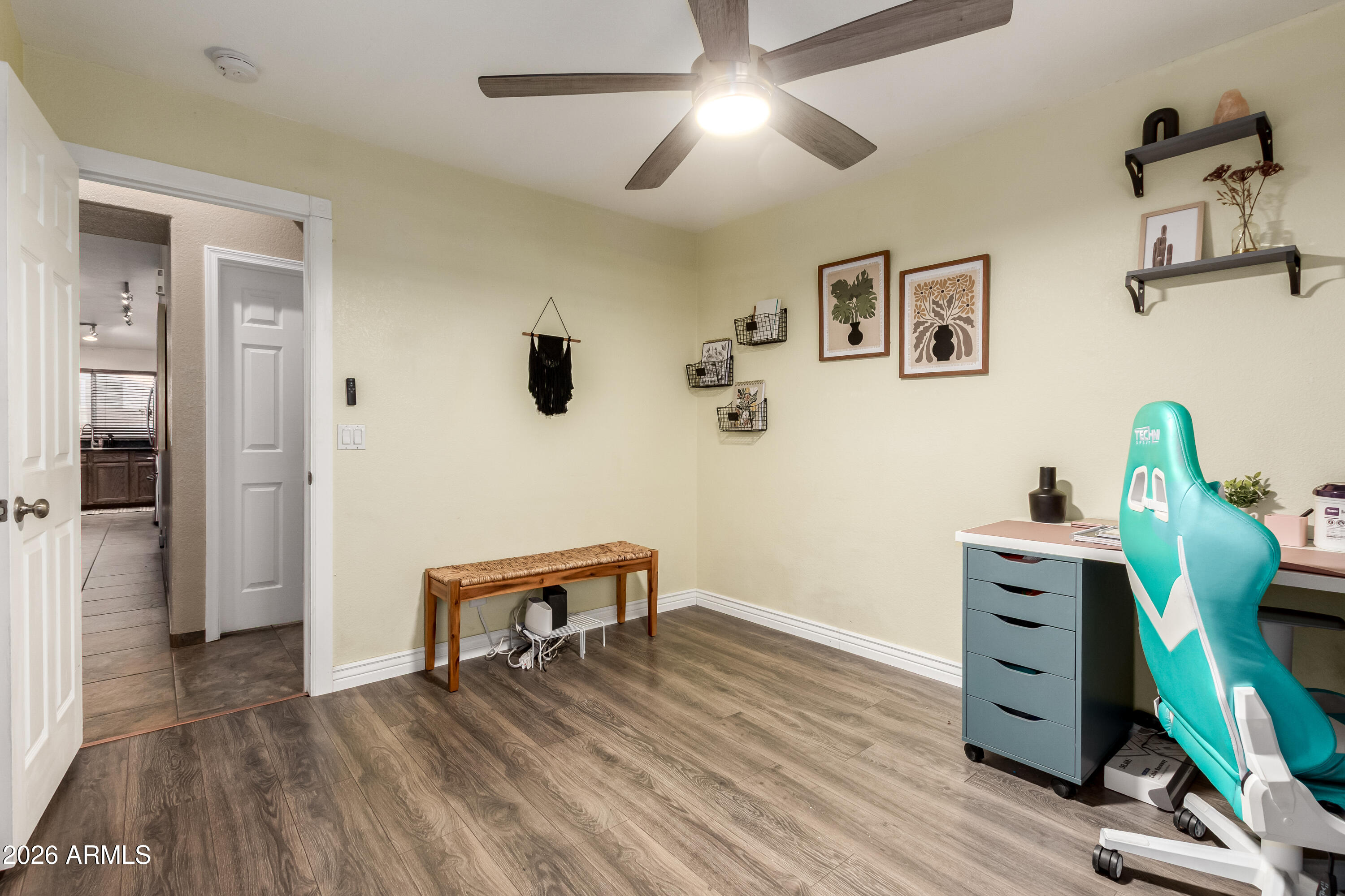 1147 North Marvin Street Gilbert, AZ 85233 - Photo 22 of 31 a view of a workspace with furniture and a window