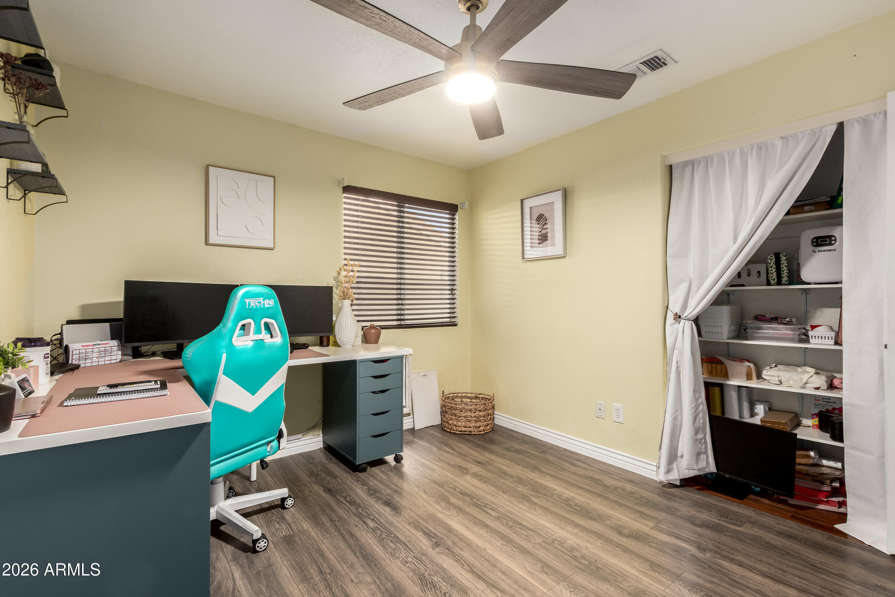 1147 North Marvin Street Gilbert, AZ 85233 - Photo 23 of 31 a view of a workspace with furniture and a window