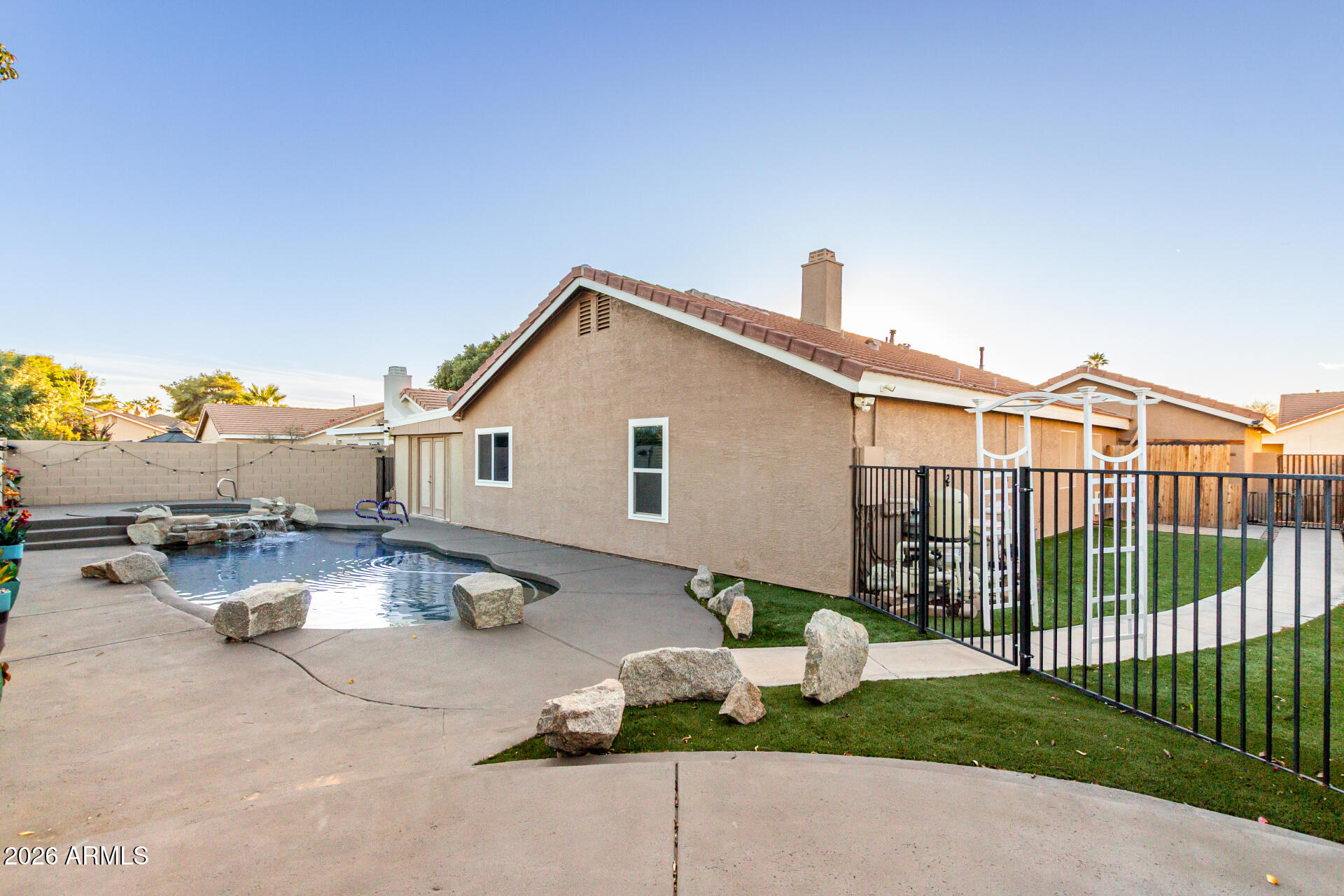 1147 North Marvin Street Gilbert, AZ 85233 - Photo 30 of 31 a view of a house with backyard and sitting area