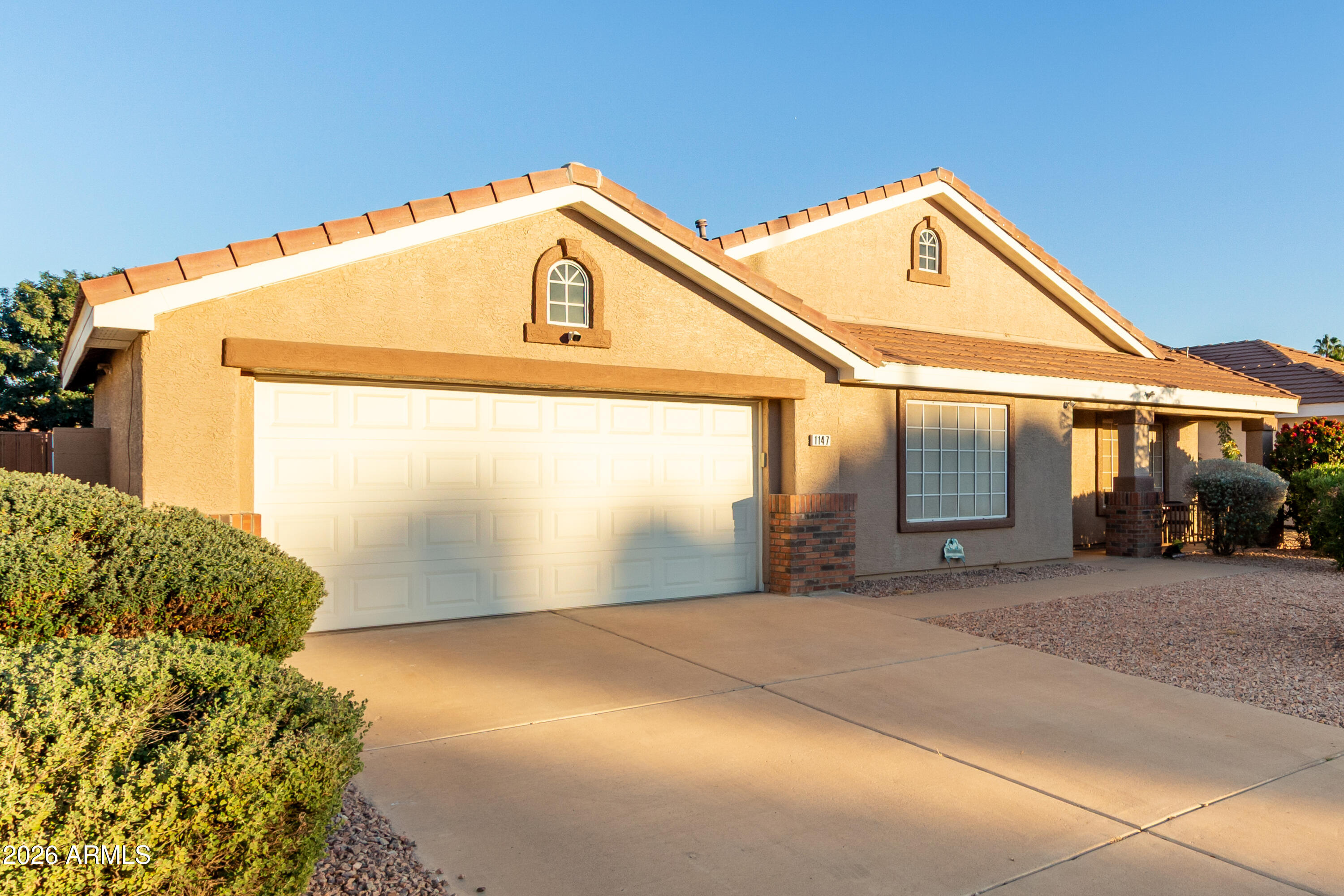 1147 North Marvin Street Gilbert, AZ 85233 - Photo 31 of 31 a front view of a house with a yard
