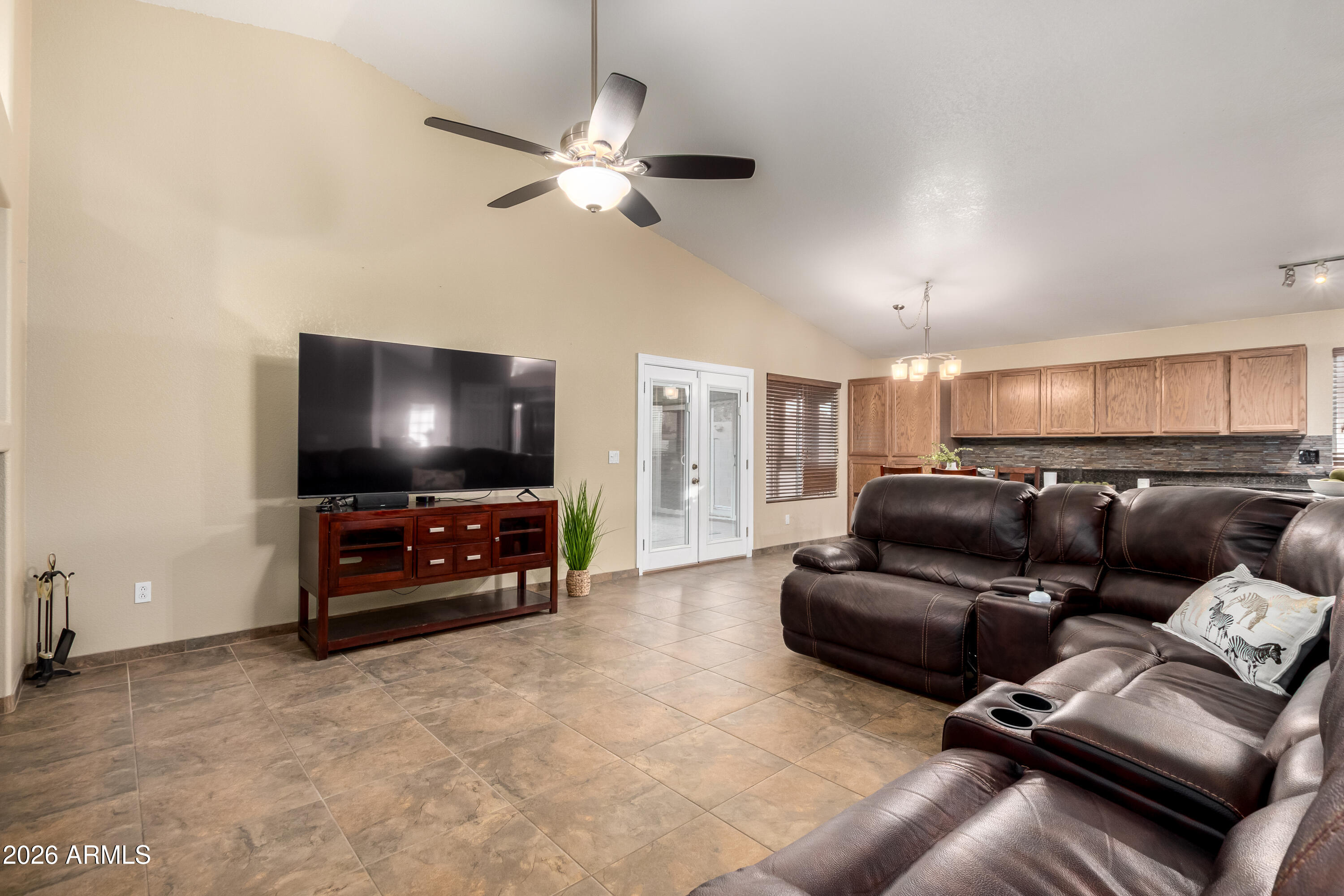 1147 North Marvin Street Gilbert, AZ 85233 - Photo 8 of 31 a living room with furniture and a flat screen tv