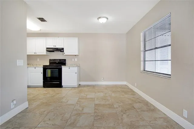 a kitchen with stainless steel appliances granite countertop a stove and a refrigerator