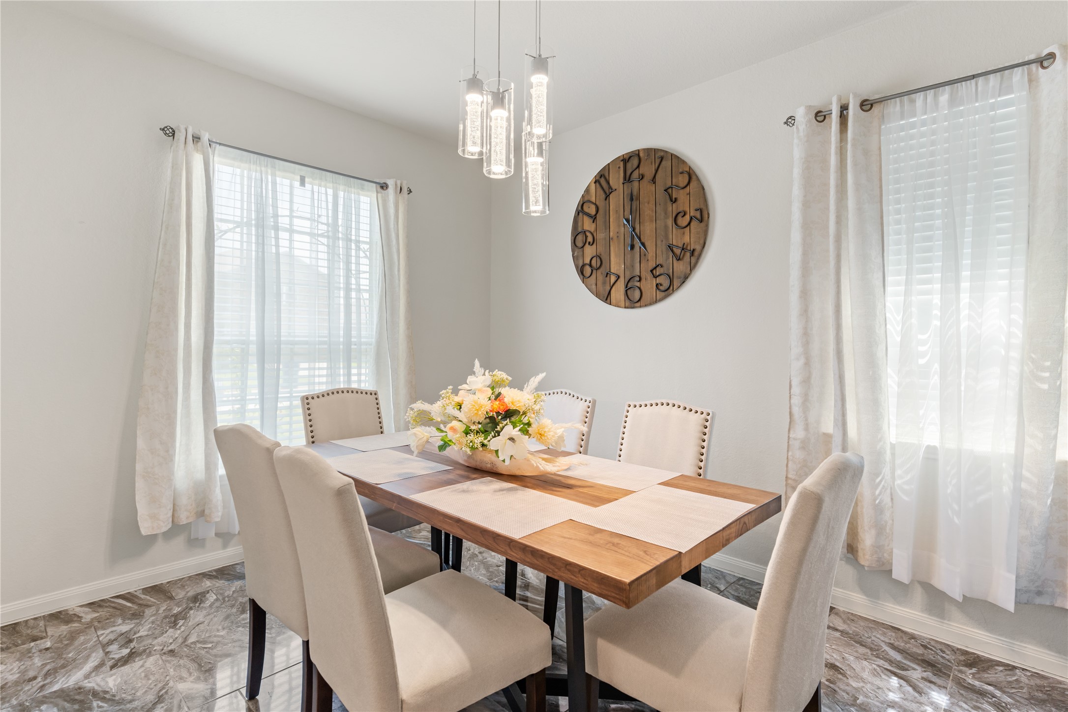 10731 Spring Brook Pass Drive Humble, TX 77396 - Photo 5 of 31 a view of a dining room with furniture window and wooden floor