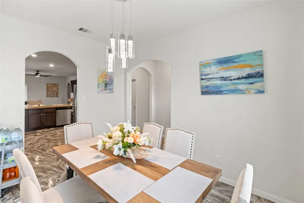 a view of a dining room with furniture and wooden floor
