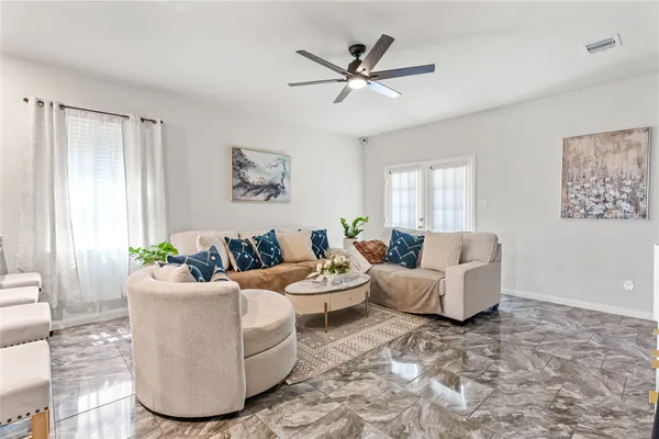 a living room with furniture and a window
