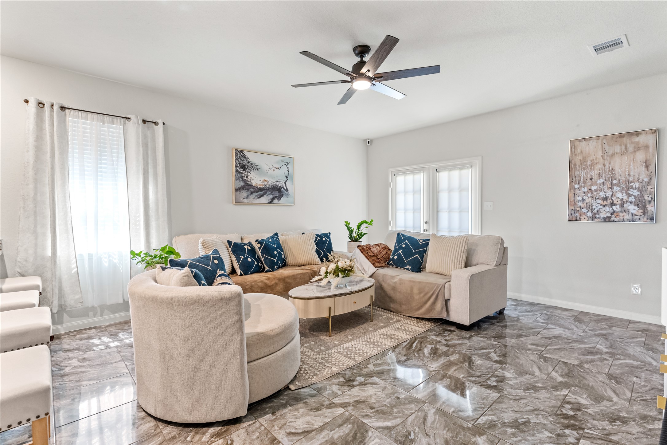 10731 Spring Brook Pass Drive Humble, TX 77396 - Photo 8 of 31 a living room with furniture and a window