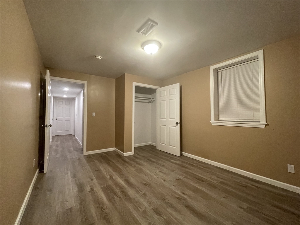 15 Carriage Lane Amherst, MA 01002 - Photo 16 of 23 a view of hallway with bathroom and wooden floor