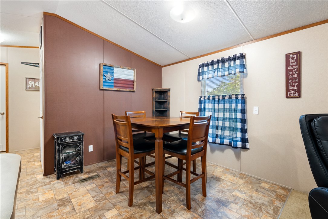 1061 Tafelski Road New Waverly, TX 77358 - Photo 11 of 37 a dining room with furniture and window