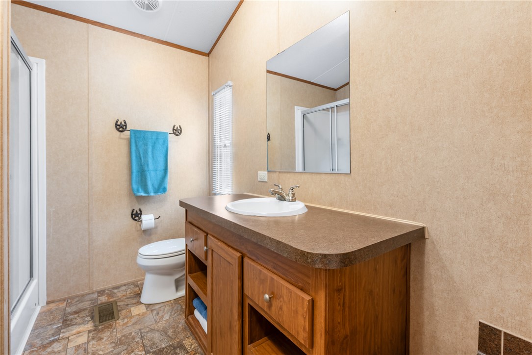 1061 Tafelski Road New Waverly, TX 77358 - Photo 18 of 37 a bathroom with a sink and a mirror