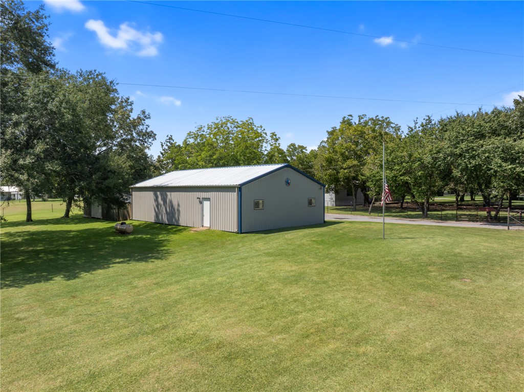 1061 Tafelski Road New Waverly, TX 77358 - Photo 33 of 37 a house view with a garden space