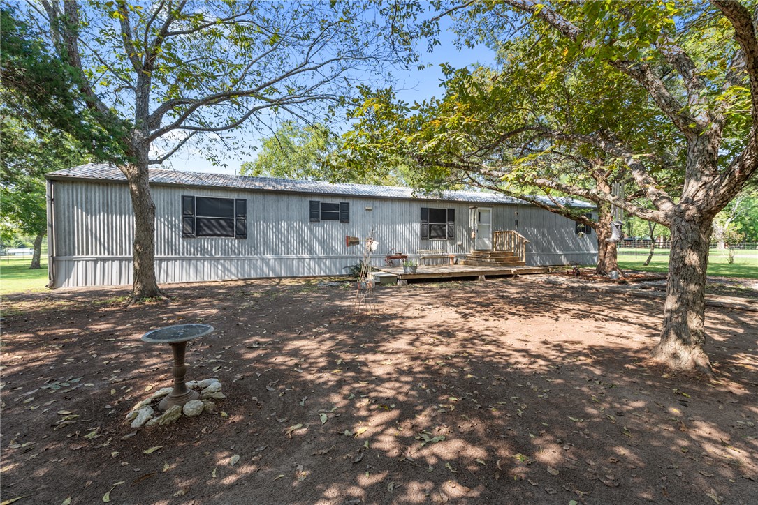 1061 Tafelski Road New Waverly, TX 77358 - Photo 5 of 37 a front view of house with yard and trees around