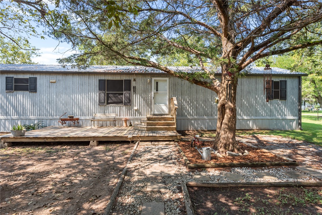 1061 Tafelski Road New Waverly, TX 77358 - Photo 7 of 37 a backyard of a house with barbeque oven
