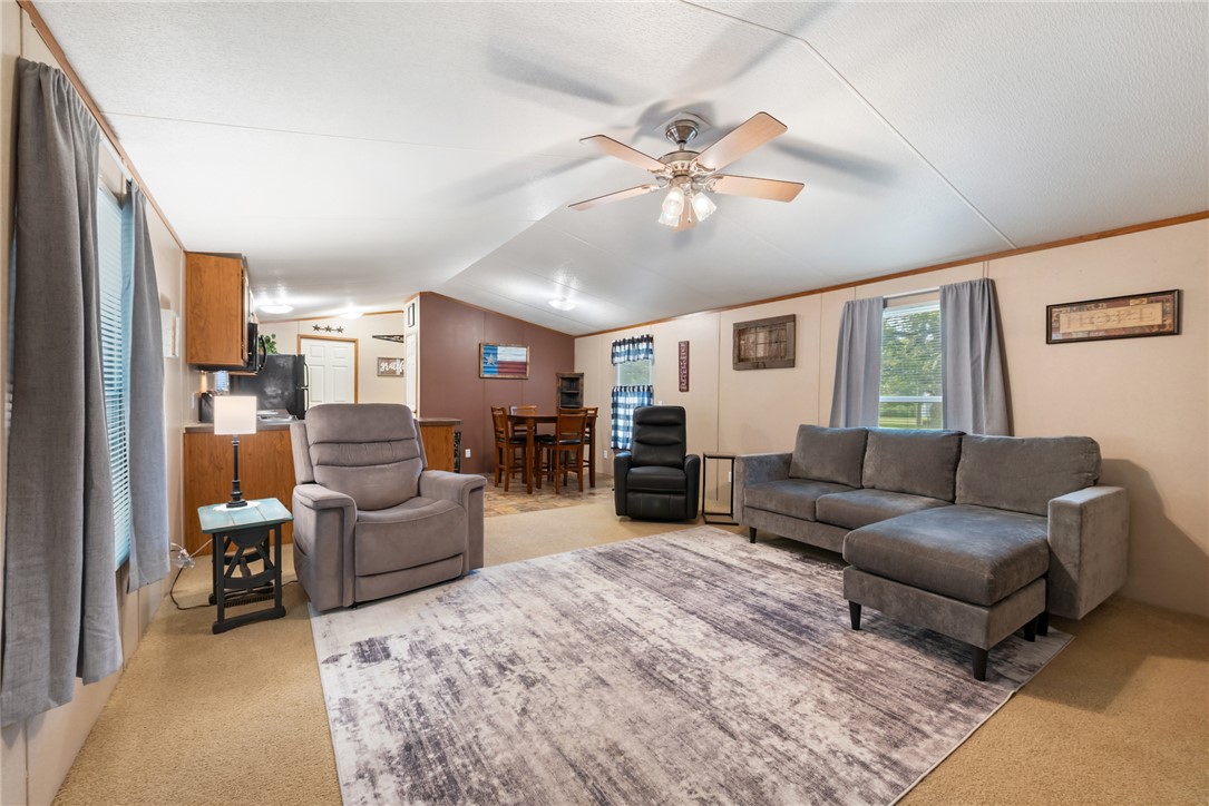 1061 Tafelski Road New Waverly, TX 77358 - Photo 8 of 37 a living room with furniture and a large window