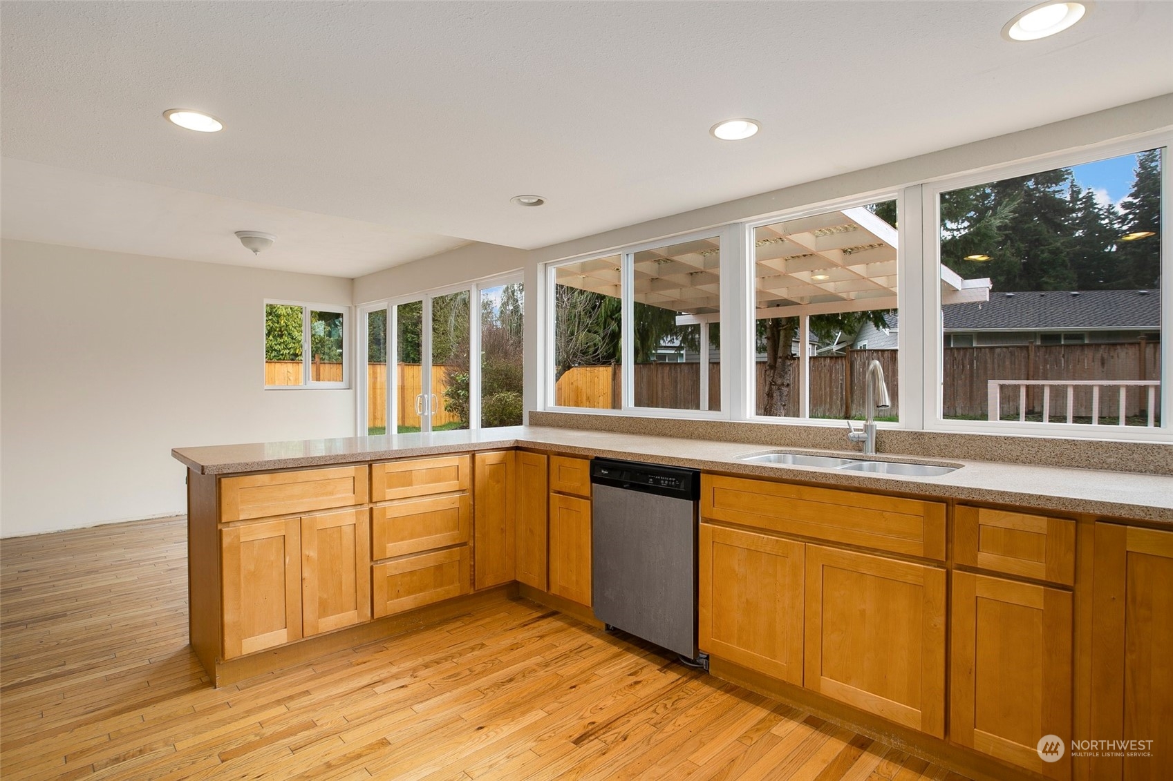 16810 143rd Avenue Southeast Renton, WA 98058 - Photo 15 of 38 a kitchen with stainless steel appliances granite countertop a stove and a sink with granite countertops
