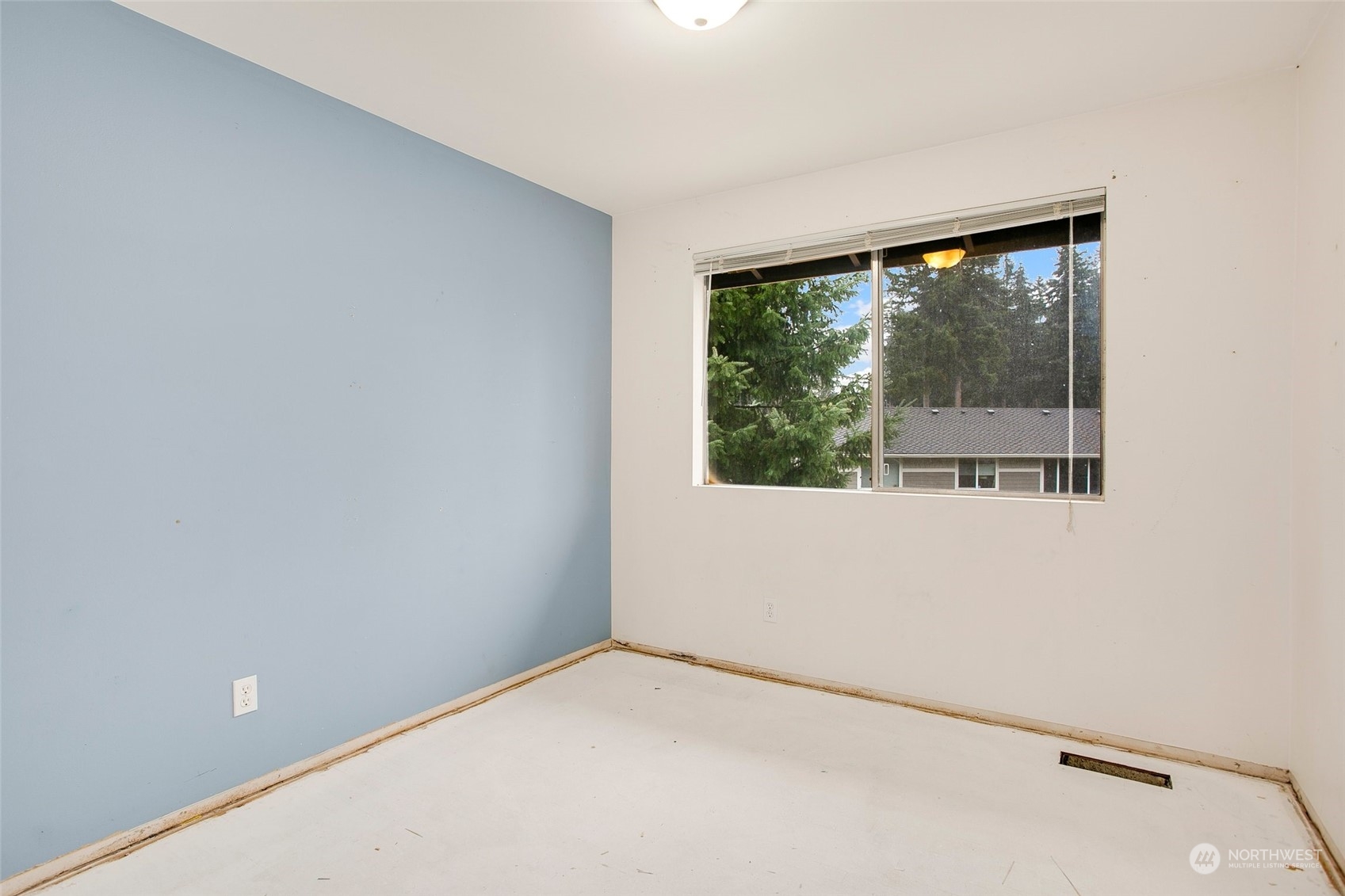 16810 143rd Avenue Southeast Renton, WA 98058 - Photo 18 of 38 a view of an empty room with a window