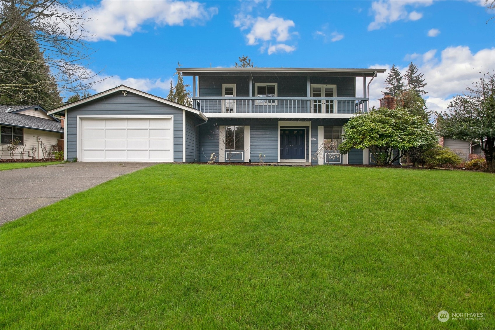 16810 143rd Avenue Southeast Renton, WA 98058 - Photo 2 of 38 a front view of a house with a yard and garage