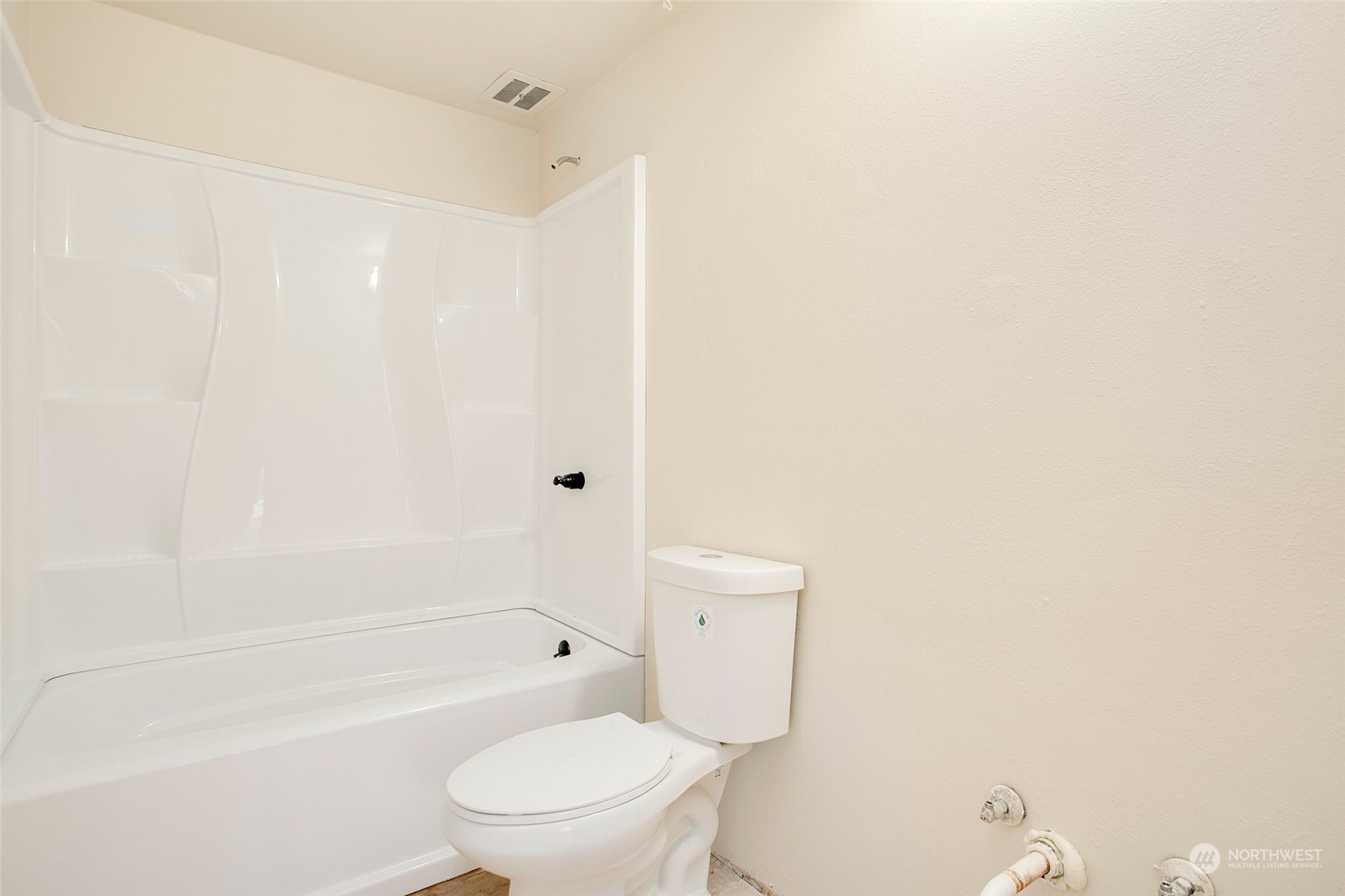 16810 143rd Avenue Southeast Renton, WA 98058 - Photo 28 of 38 a bathroom with a toilet and a bathtub