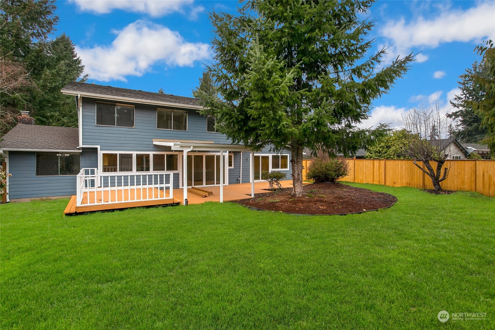 16810 143rd Avenue Southeast Renton, WA 98058 - Photo 38 of 38 a view of a house with a yard and a patio