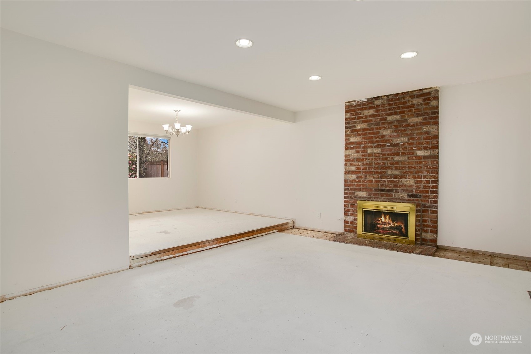 16810 143rd Avenue Southeast Renton, WA 98058 - Photo 5 of 38 an empty room with a fireplace
