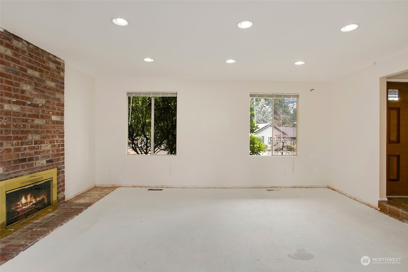 16810 143rd Avenue Southeast Renton, WA 98058 - Photo 8 of 38 an empty room with windows